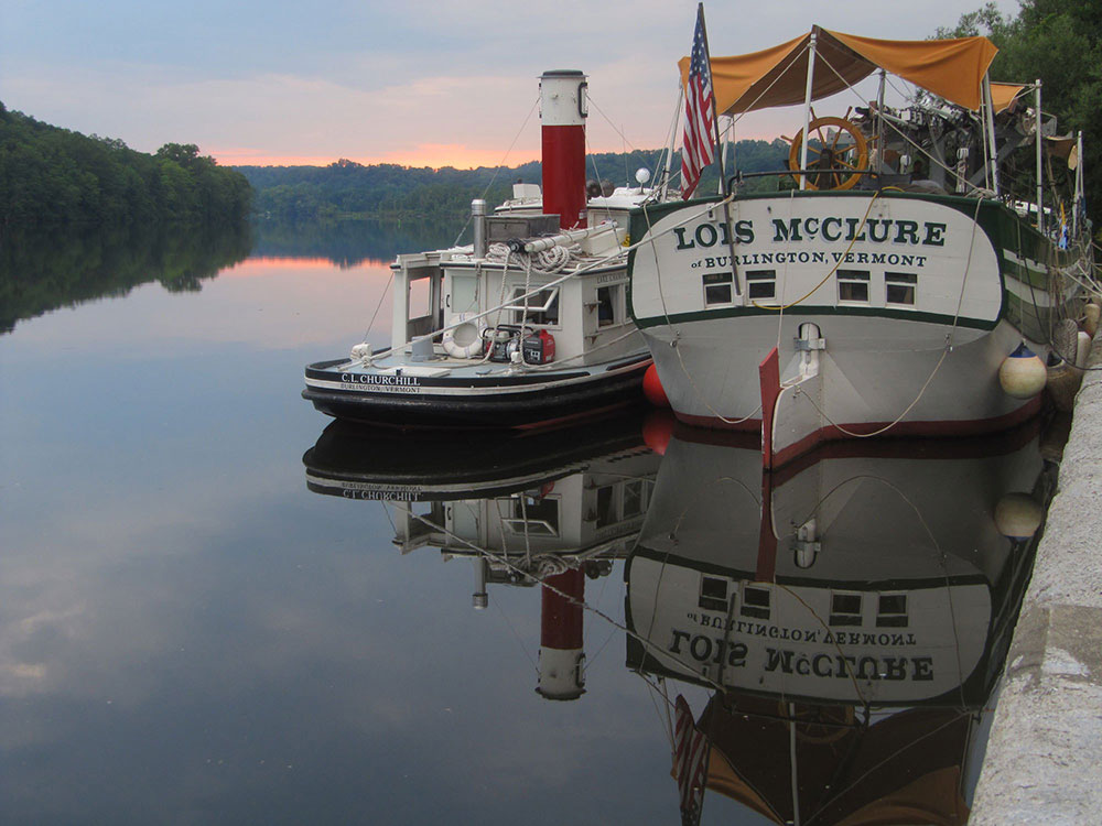 C.L. Churchill tugboat and Lois McLure canal barge from aft, docked, evening 