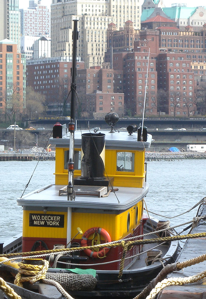 tugboat W.O. Decker, view from aft with New York City across river